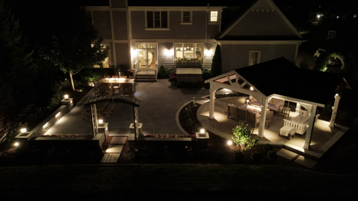 Pewaukee Nightscape Patio & Fireside Retreat with Stunning Pavilion After Hardscape Renovation